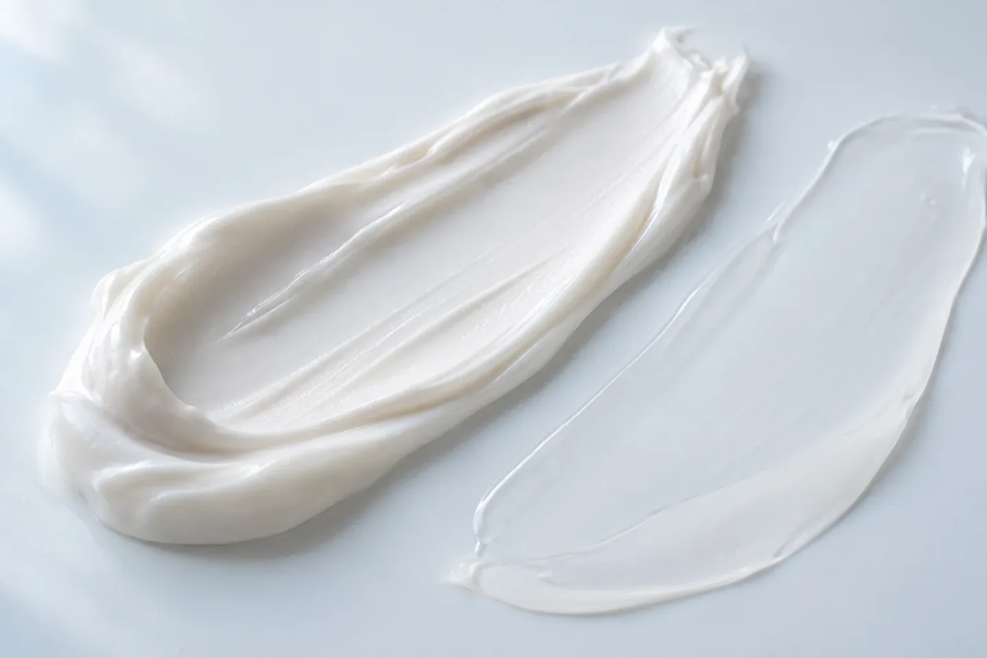 Close-up material study of white cream and translucent gel textures